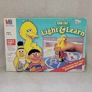 1991 Sesame Street Light and Learn letter & number game with magic wand 18 sheet